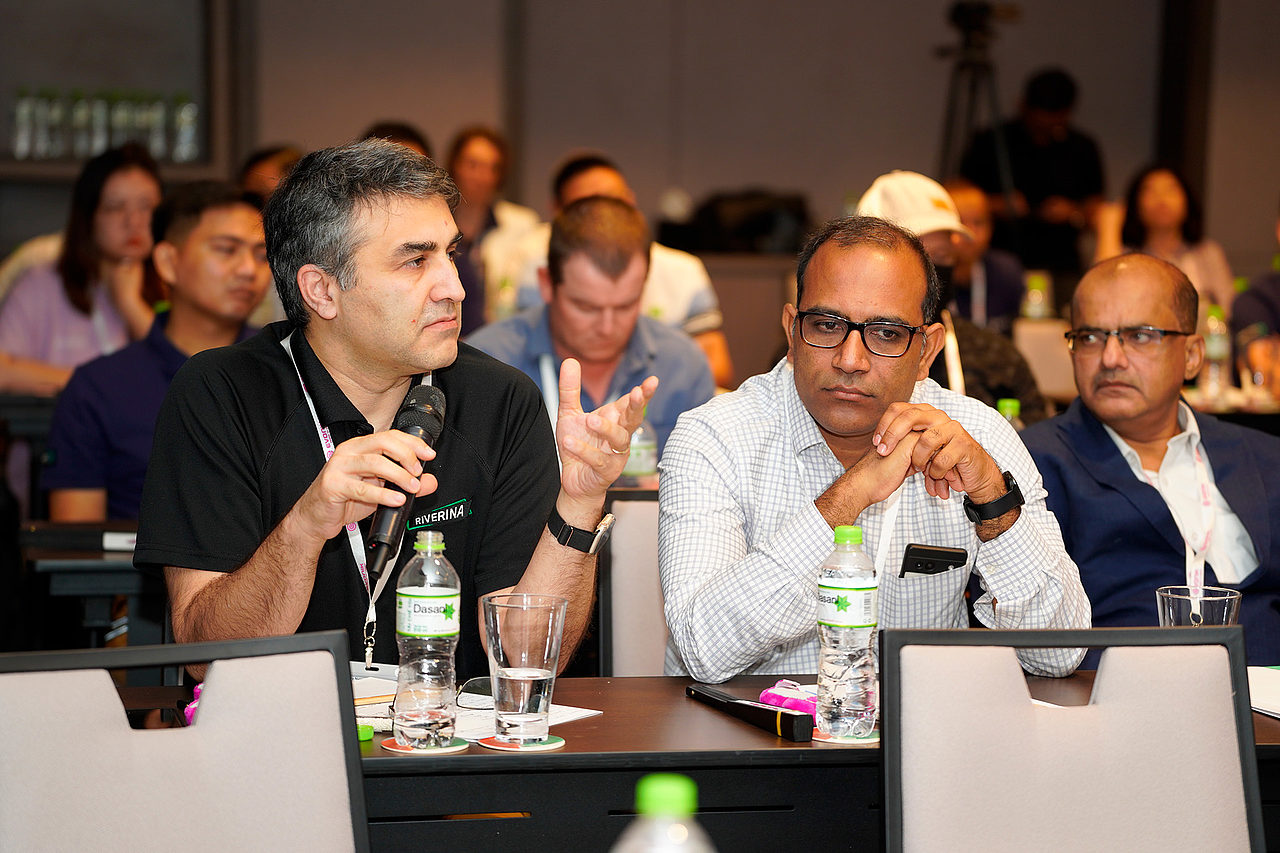 Riverina team members speaking at a conference